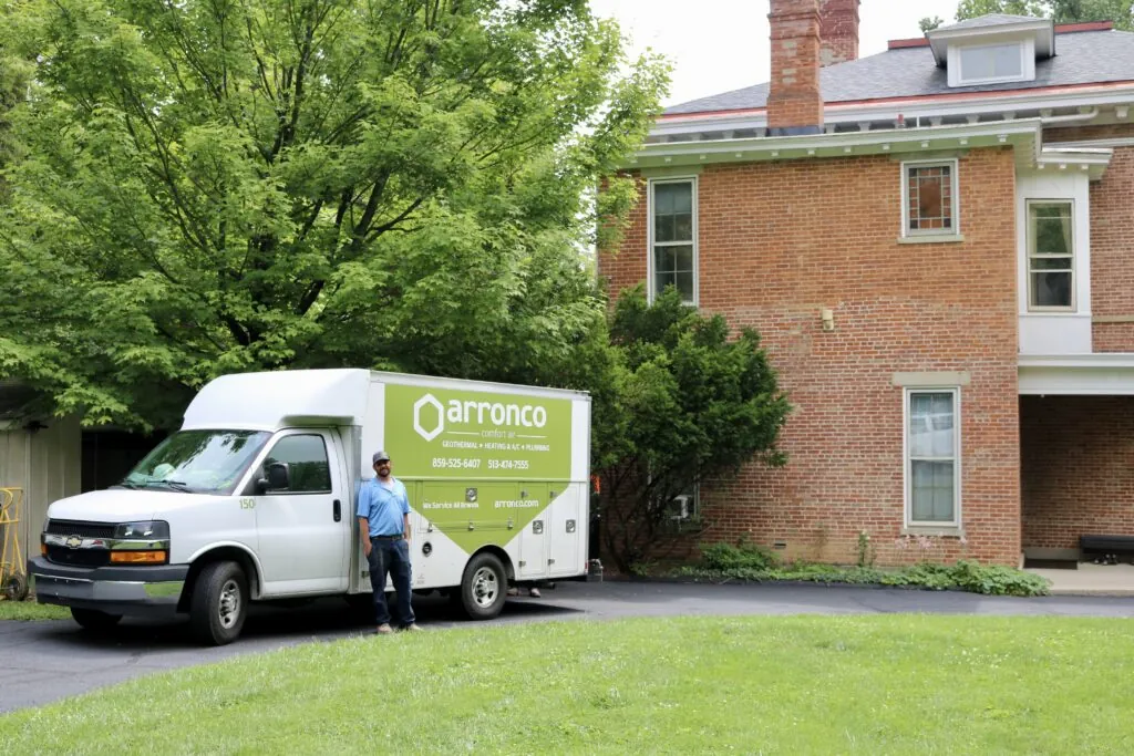 A technician in front of an Arronco van